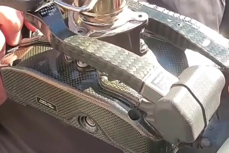 The rear paddles on Lewis Hamilton’s Mercedes-AMG steering wheel, captured from the featured video.